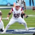 Feb 8, 2026; Santa Clara, CA, USA; New England Patriots center Garrett Bradbury (65) blocks against the Seattle Seahawks during the first quarter in Super Bowl LX at Levi's Stadium.