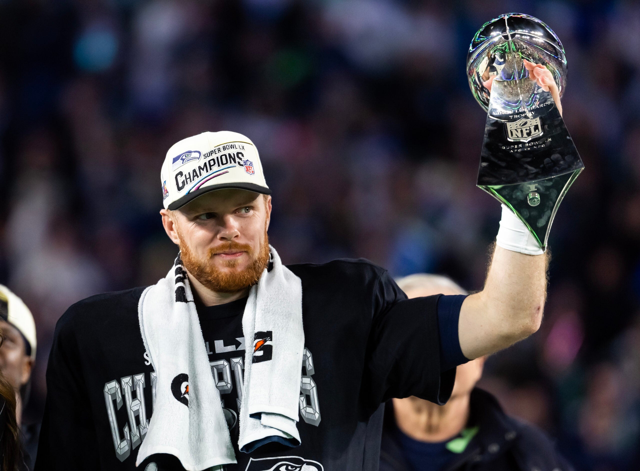 Feb 8, 2026; Santa Clara, CA, USA; Seattle Seahawks quarterback Sam Darnold (14) celebrates with the Vince Lombardi Trophy after defeating the New England Patriots during Super Bowl LX at Levi's Stadium.
