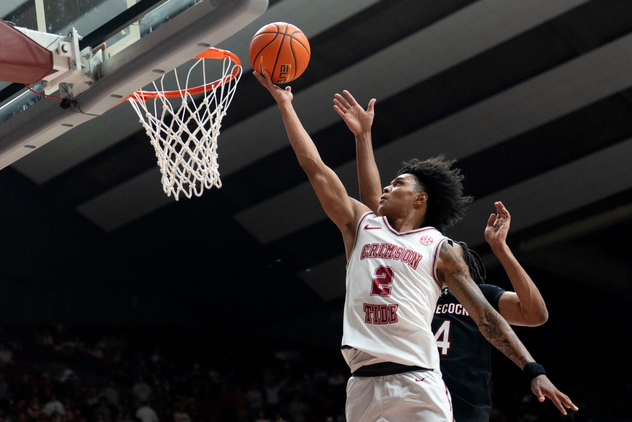 Alabama guard Aden Holloway (2) goes to the basket against South Carolina guard Kobe Knox (4) at Coleman Coliseum. Alabama defeated South Carolina 89-75.