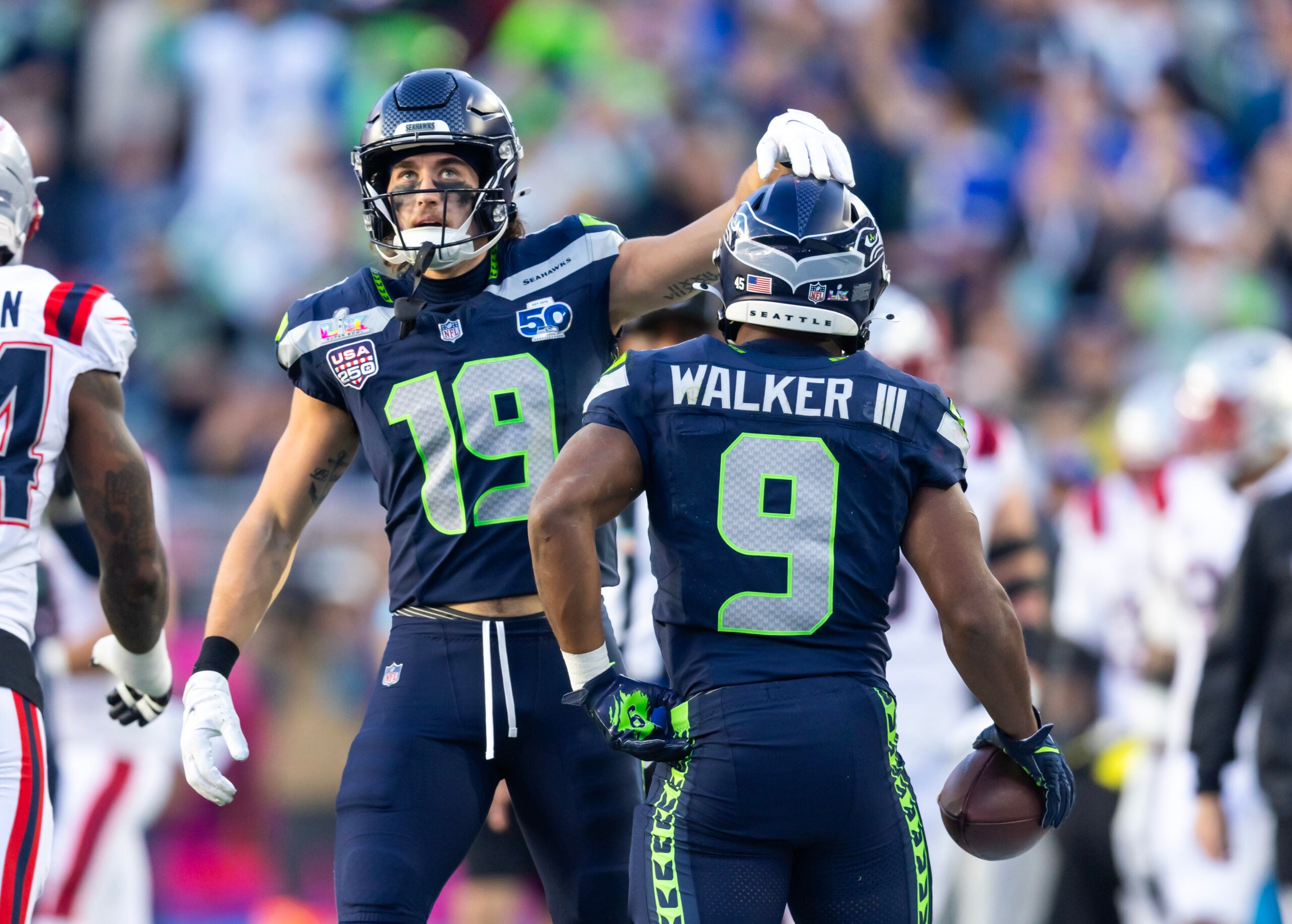Feb 8, 2026; Santa Clara, CA, USA; Seattle Seahawks wide receiver Jake Bobo (19) with running back Kenneth Walker III (9) against the New England Patriots during Super Bowl LX at Levi's Stadium.
