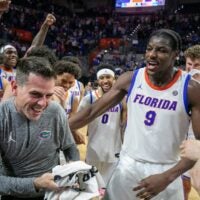 Florida head coach Todd Golden celebrates his 100th win and beating Mississippi State 108-77 with Florida center Rueben Chinyelu (9) and the rest of the team after an NCAA mens basketball game at Steven C. O'Connell Center Exactek arena in Gainesville, FL on Tuesday, March 3, 2026. Alan Youngblood/Gainesville Sun