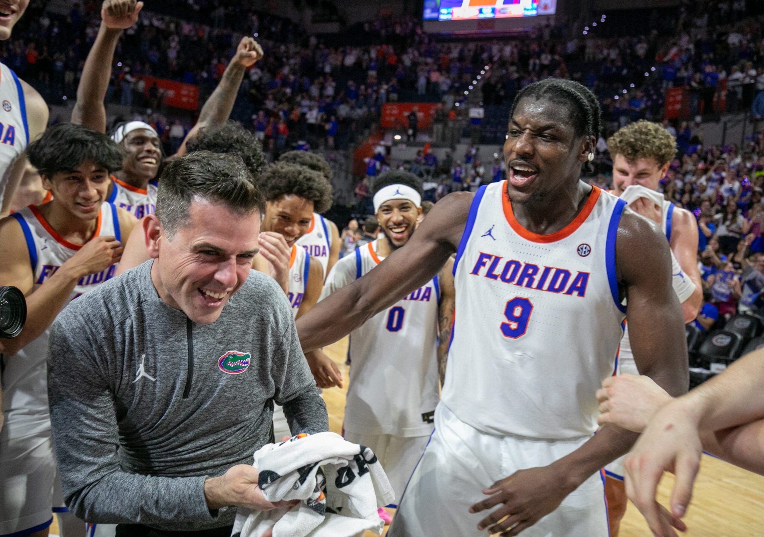Florida head coach Todd Golden celebrates his 100th win and beating Mississippi State 108-77 with Florida center Rueben Chinyelu (9) and the rest of the team after an NCAA mens basketball game at Steven C. O'Connell Center Exactek arena in Gainesville, FL on Tuesday, March 3, 2026. Alan Youngblood/Gainesville Sun