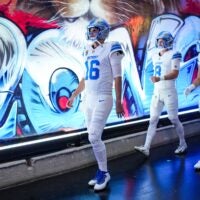 Detroit Lions quarterback Jared Goff walks down the tunnel with quarterback Kyle Allen (8) and wide receiver Isaac Teslaa (18) for warmups ahead of the Dallas Cowboys game at Ford Field in Detroit on Thursday, Dec. 4, 2025.