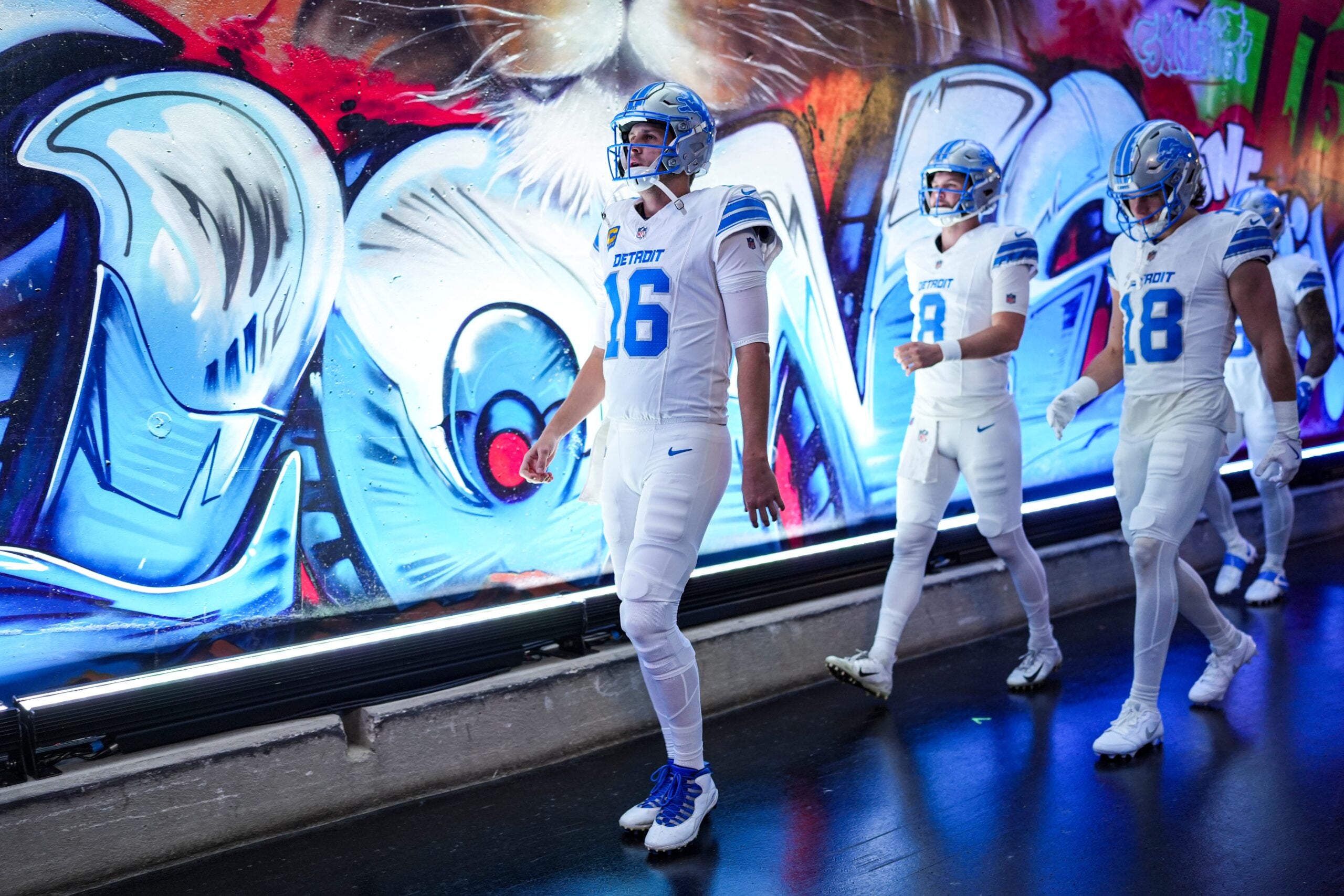 Detroit Lions quarterback Jared Goff walks down the tunnel with quarterback Kyle Allen (8) and wide receiver Isaac Teslaa (18) for warmups ahead of the Dallas Cowboys game at Ford Field in Detroit on Thursday, Dec. 4, 2025.