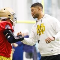 Head coach Marcus Freeman, right, greets running back Aneyas Williams during a Notre Dame football practice at Irish Athletic Center on Friday, March 20, 2026, in South Bend.