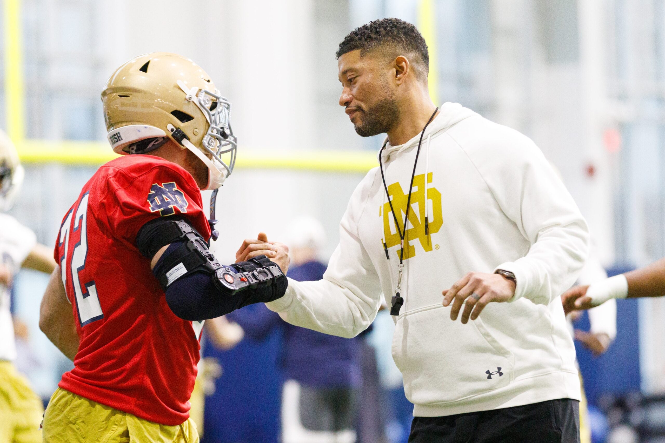 Head coach Marcus Freeman, right, greets running back Aneyas Williams during a Notre Dame football practice at Irish Athletic Center on Friday, March 20, 2026, in South Bend.