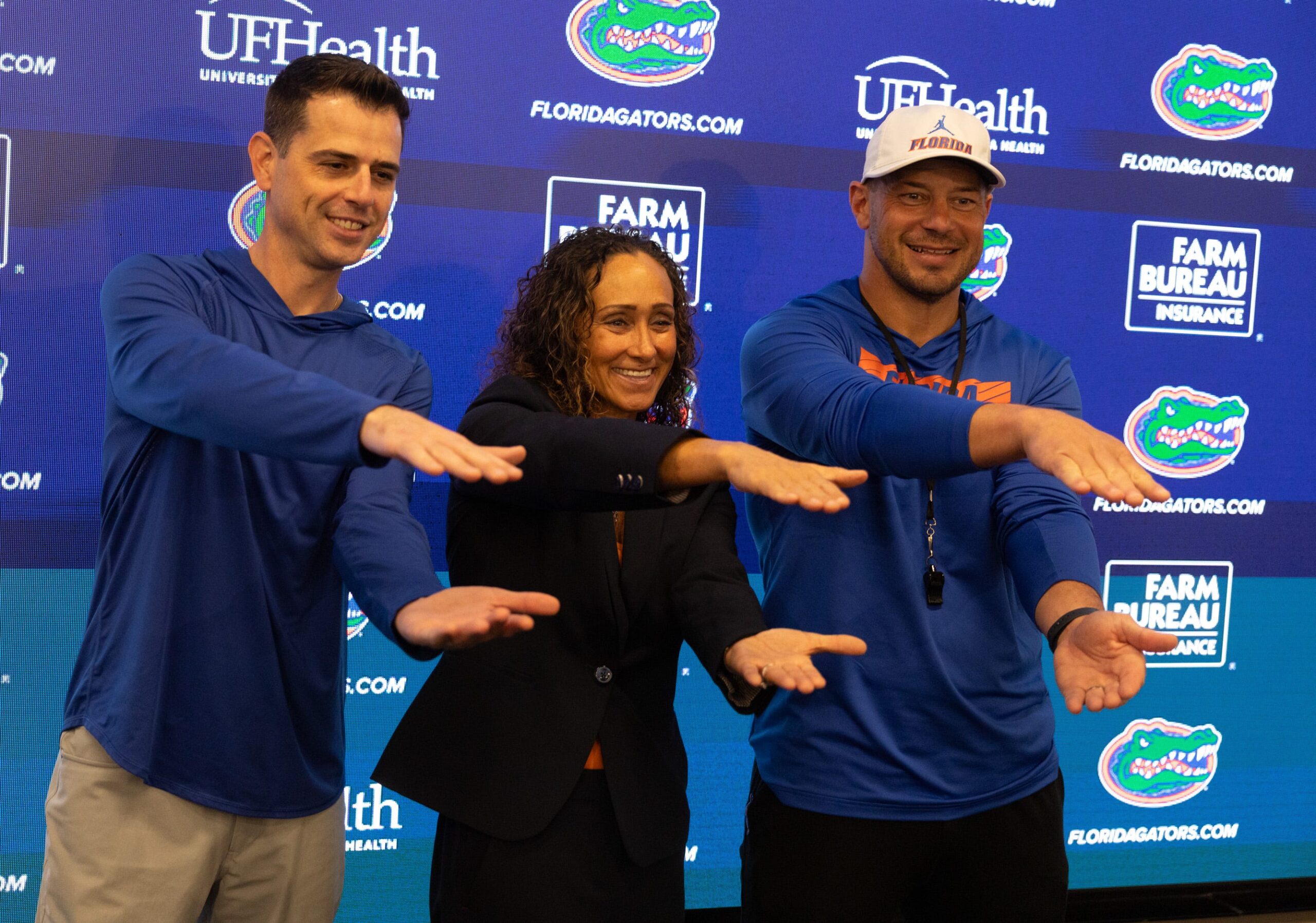 Head basketball coach Todd Golden, new Womens basketball head coach Tammi Reiss, and Florida head football coach Jon Sumrall pose for a photo during a press conference after spring practice at Sanders Practice Fields in Gainesville, FL on Tuesday, March 24, 2026.