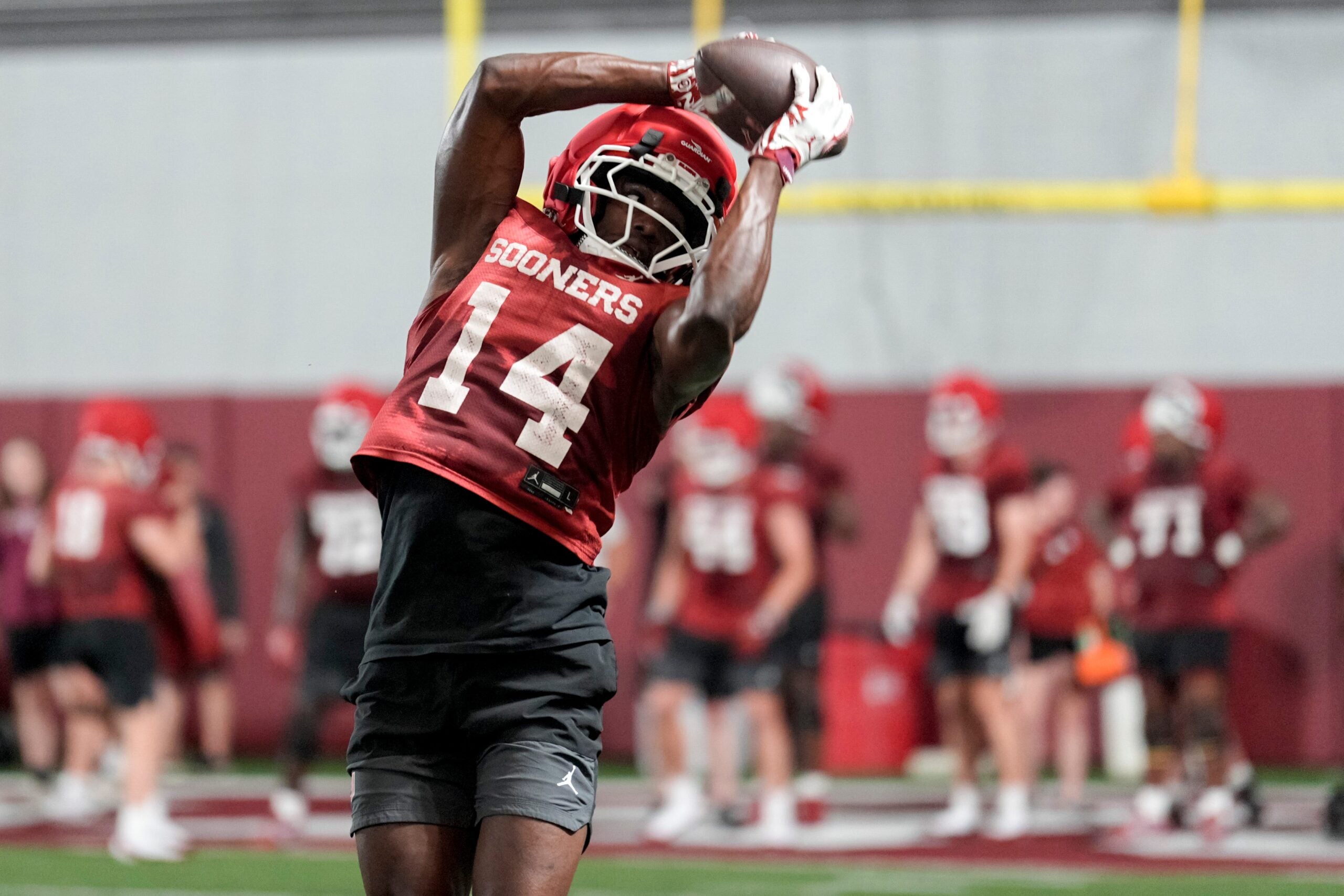 Elijah Thomas (14) runs drills during an Oklahoma (OU) football practice in Norman, Okla., on Wednesday, March 25, 2026.
