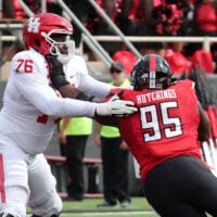 Sep 30, 2023; Lubbock, Texas, USA; Houston Cougars offensive tackle Patrick Paul (76) blocks Texas Tech Red Raiders defensive tackle Jaylon Hutchings (95) in the second half at Jones AT&T Stadium and Cody Campbell Field.