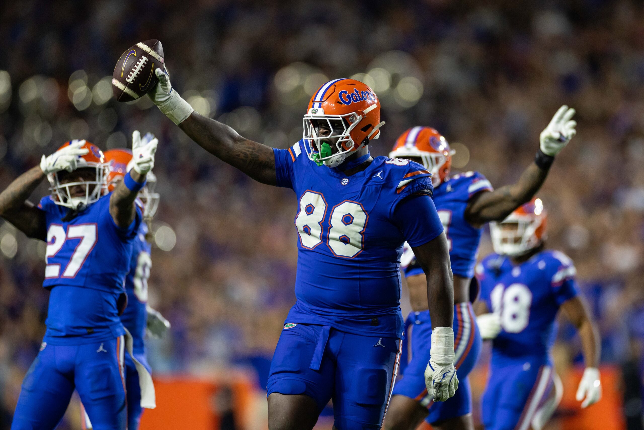 Nov 16, 2024; Gainesville, Florida, USA; Florida Gators defensive lineman Caleb Banks (88) celebrates with the ball after a fumble recovery against the LSU Tigers during the second half at Ben Hill Griffin Stadium.