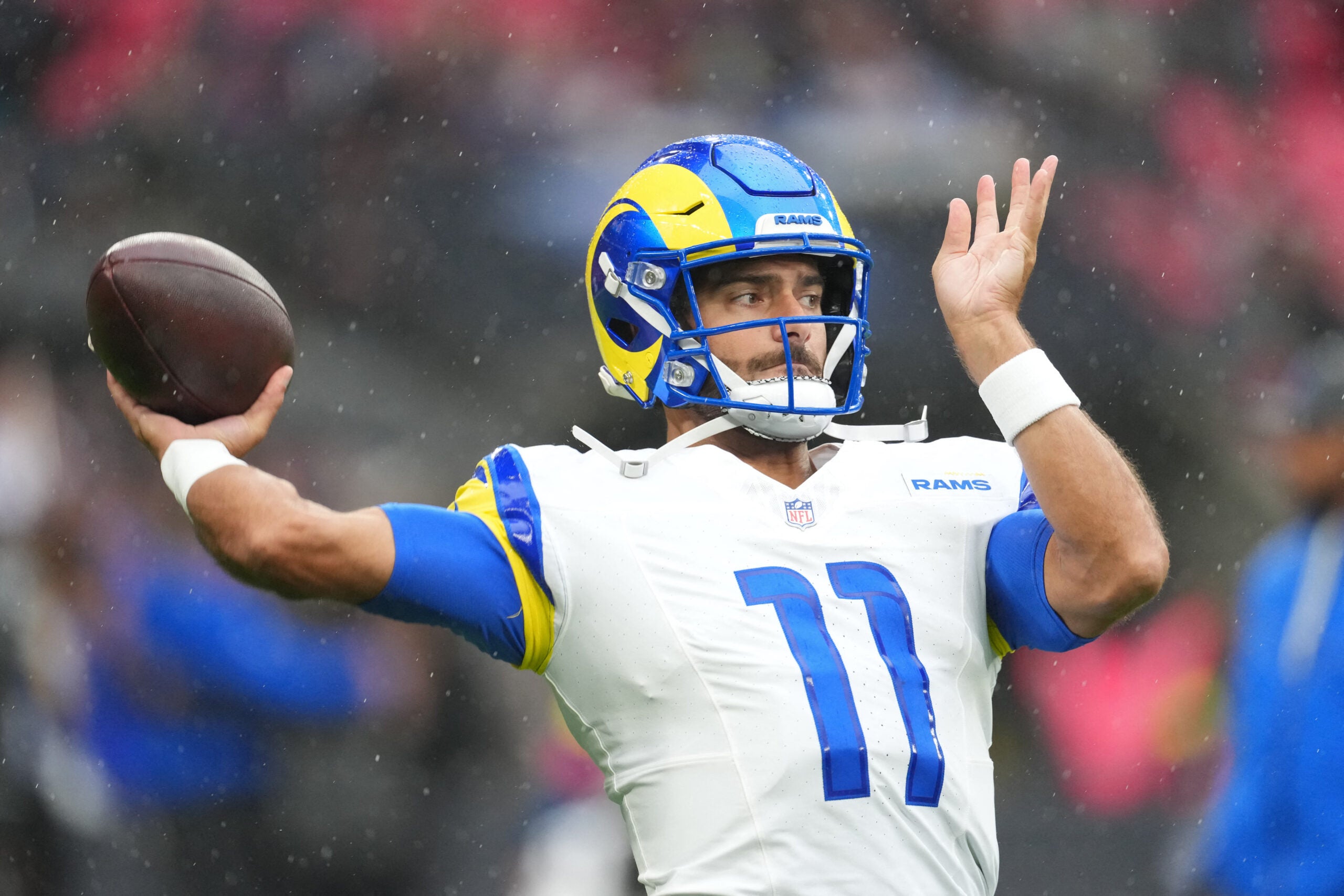 Oct 19, 2025; London, United Kingdom; Los Angeles Rams quarterback Jimmy Garoppolo (11) warms up before a NFL International Series game between the Los Angeles Rams and the Jacksonville Jaguars at Wembley Stadium.