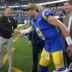 Les Snead, general manager of the Los Angeles Rams shakes the hand of quarterback Matthew Stafford (9) following a game against the New Orleans Saints at SoFi Stadium.