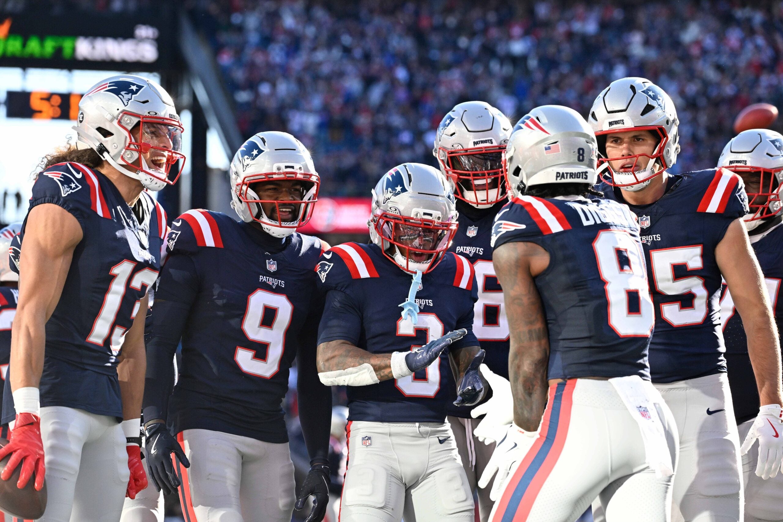 Nov 2, 2025; Foxborough, Massachusetts, USA; New England Patriots wide receiver Mack Hollins (13), wide receiver Kayshon Boutte (9), wide receiver DeMario Douglas (3), offensive tackle Morgan Moses (76), and tight end Hunter Henry (85) come together to celebrate wide receiver Stefon Diggs (8) touchdown during the first half against the Atlanta Falcons at Gillette Stadium.