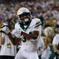 Nov 15, 2025; Waco, Texas, USA; Baylor Bears wide receiver Josh Cameron (34) reacts after scoring a touchdown against the Utah Utes during the first half at McLane Stadium.