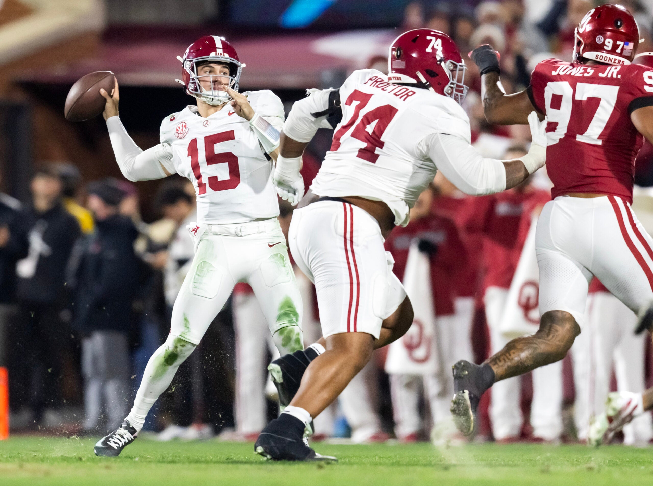 Dec 19, 2025; Norman, OK, USA; Alabama Crimson Tide quarterback Ty Simpson (15) and offensive lineman Kadyn Proctor (74) against the Oklahoma Sooners during the CFP National Playoff First Round at Gaylord Family Oklahoma Memorial Stadium.