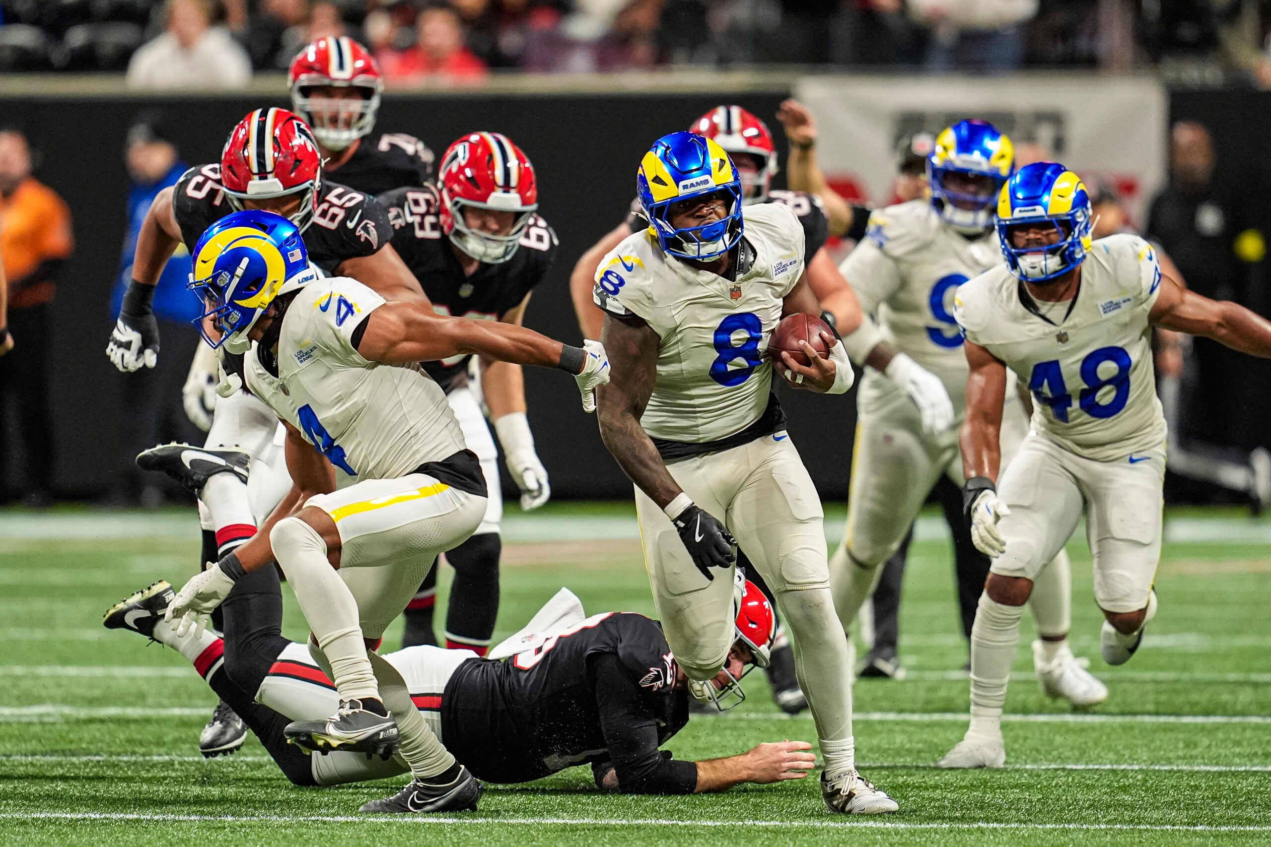 Dec 29, 2025; Atlanta, Georgia, USA; Los Angeles Rams linebacker Jared Verse (8) blocks a Atlanta Falcons field goal and returns it for a touchdown during the second half at Mercedes-Benz Stadium.