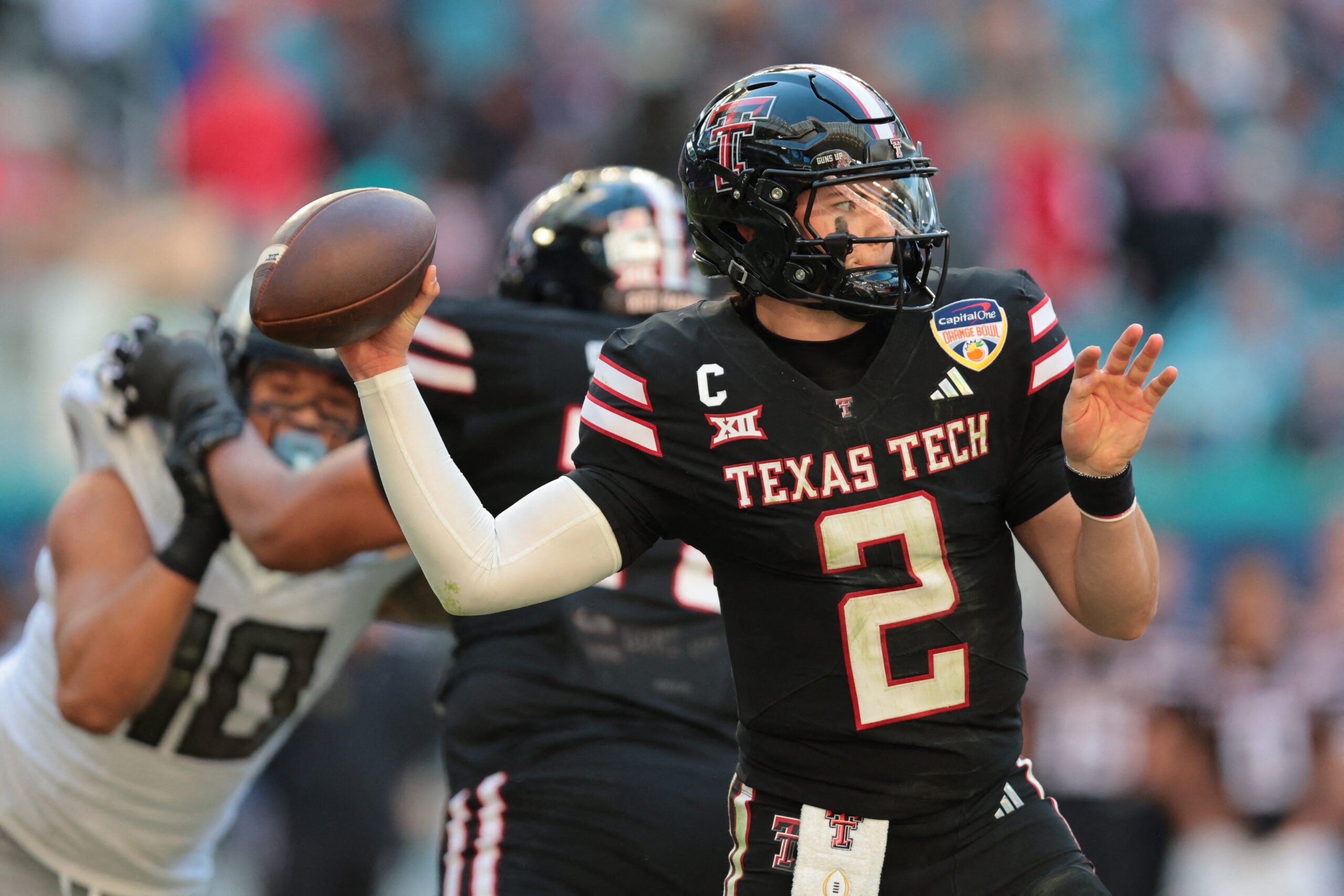 Jan 1, 2026; Miami Gardens, FL, USA; Texas Tech Red Raiders quarterback Behren Morton (2) throws a pass against the Oregon Ducks during the second half of the 2025 Orange Bowl and quarterfinal game of the College Football Playoff at Hard Rock Stadium.