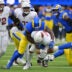 Jan 4, 2026; Inglewood, California, USA; Arizona Cardinals quarterback Jacoby Brissett (7) is sacked by Los Angeles Rams linebacker Byron Young (0) during the first half at SoFi Stadium.