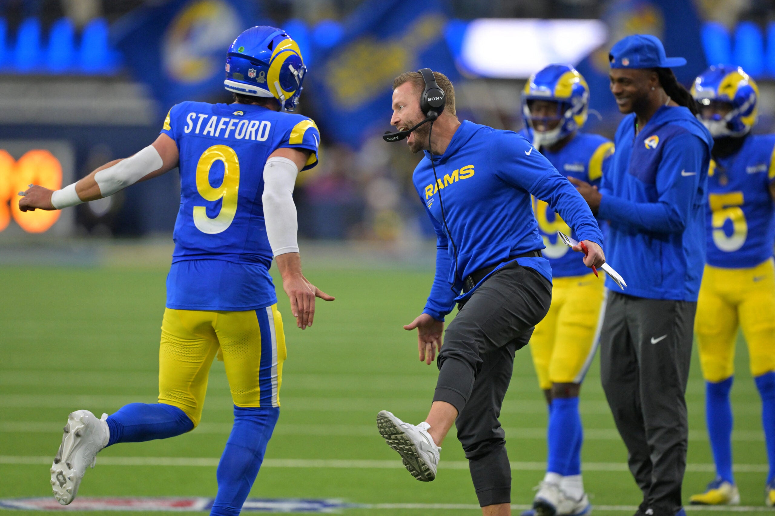 Jan 4, 2026; Inglewood, California, USA; Los Angeles Rams head coach Sean McVay reacts with quarterback Matthew Stafford (9) after a touchdown against the Arizona Cardinals during the second half at SoFi Stadium.