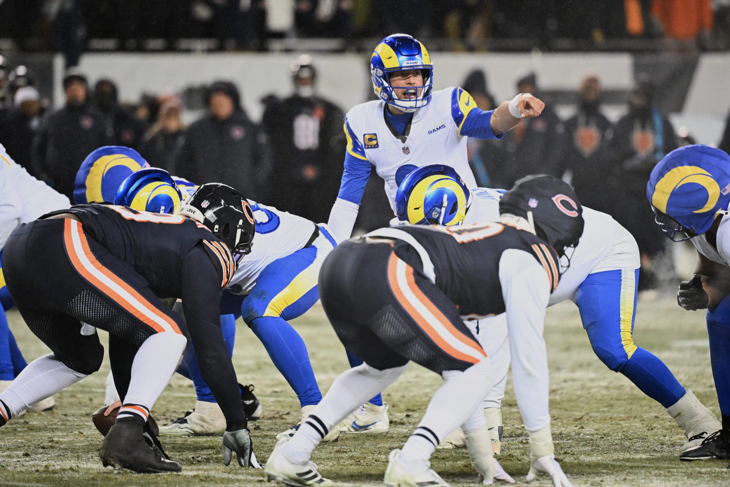 Jan 18, 2026; Chicago, IL, USA; Los Angeles Rams quarterback Matthew Stafford (9) calls the snap count at the line of scrimmage against the Chicago Bears during the fourth quarter of an NFC Divisional Round game at Soldier Field.