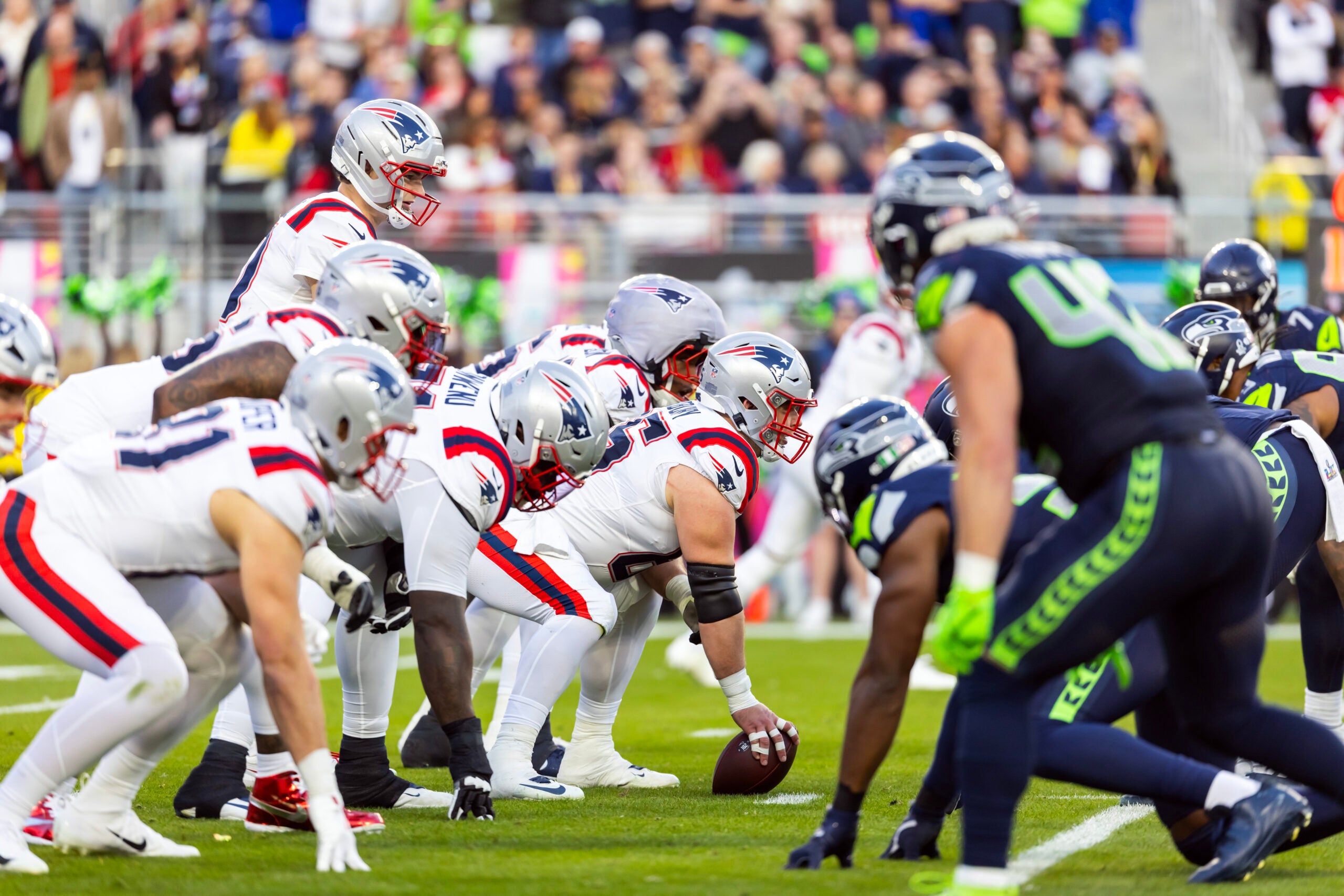 Feb 8, 2026; Santa Clara, CA, USA; New England Patriots center Garrett Bradbury (65) prepares to snap the ball to quarterback Drake Maye (10) against the Seattle Seahawks during Super Bowl LX at Levi's Stadium.
