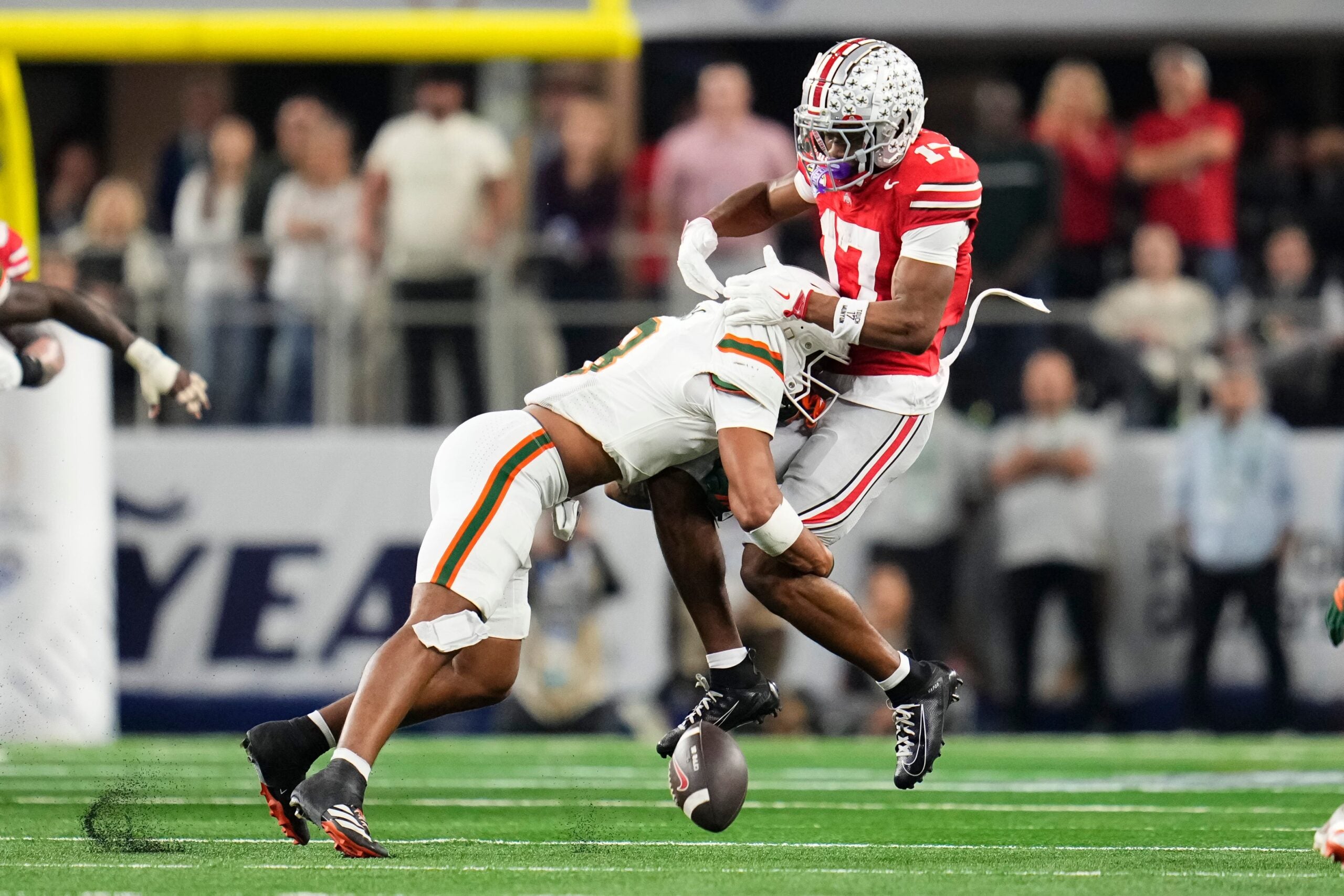 Miami Hurricanes defensive back Jakobe Thomas (8) forces an incomplete pass intended for Ohio State Buckeyes wide receiver Carnell Tate (17) during the Cotton Bowl at AT&T Stadium in Arlington, Texas for the College Football Playoff quarterfinal game on Dec. 31, 2025. Ohio State lost 24-14.