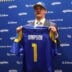 Apr 24, 2026; Inglewood, CA, USA; Los Angeles Rams first-round draft pick Ty Simpson poses with his jersey during a press conference at Code Next at Hollywood Park.