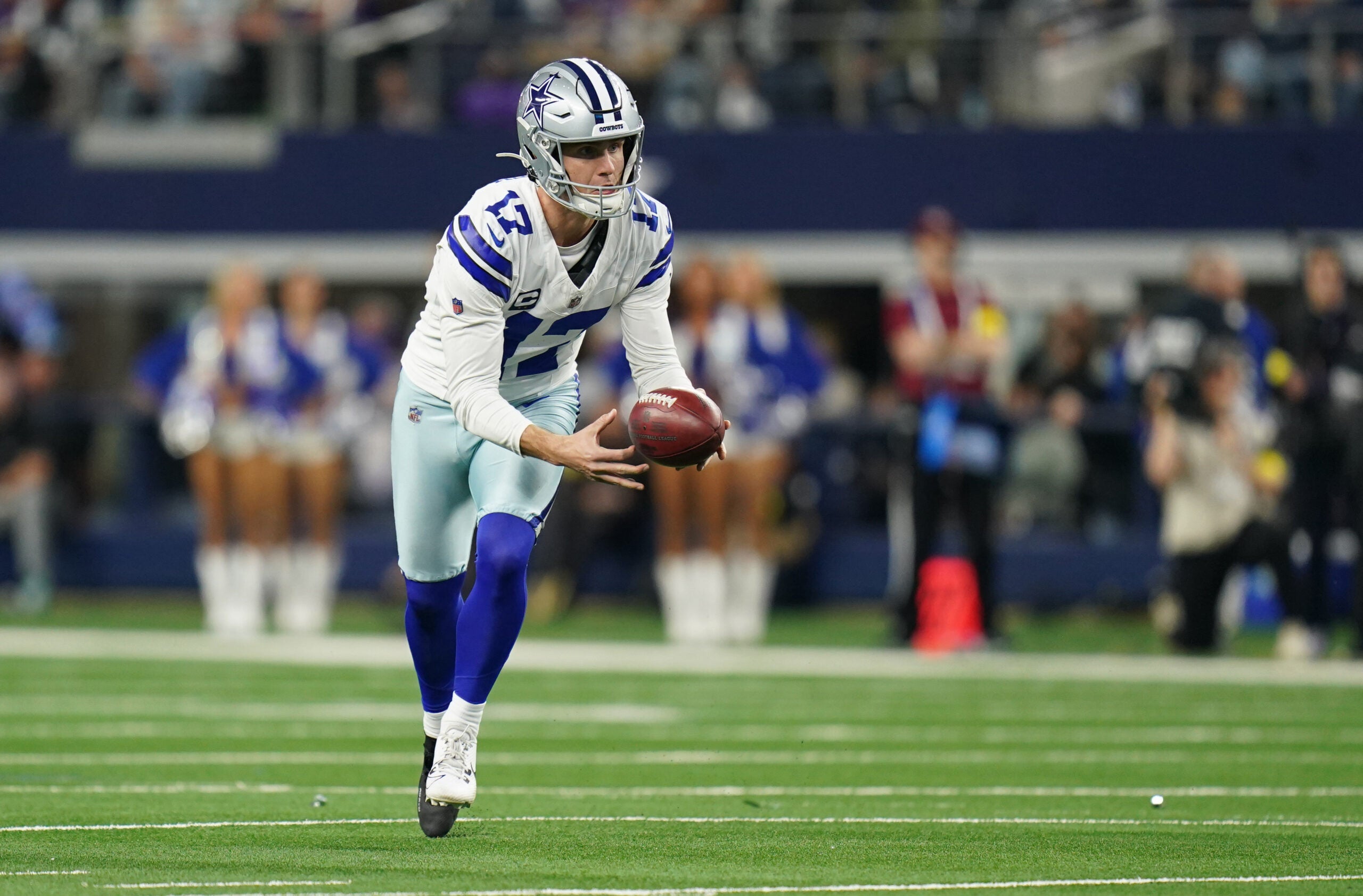 Dec 14, 2025; Arlington, Texas, USA; Dallas Cowboys place kicker Brandon Aubrey (17) runs a fake field goal during the first half against the Minnesota Vikings at AT&T Stadium.