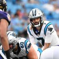 Aug 21, 2021; Charlotte, North Carolina, USA; Carolina Panthers quarterback Will Grier (7) at the line in the first quarter at Bank of America Stadium.