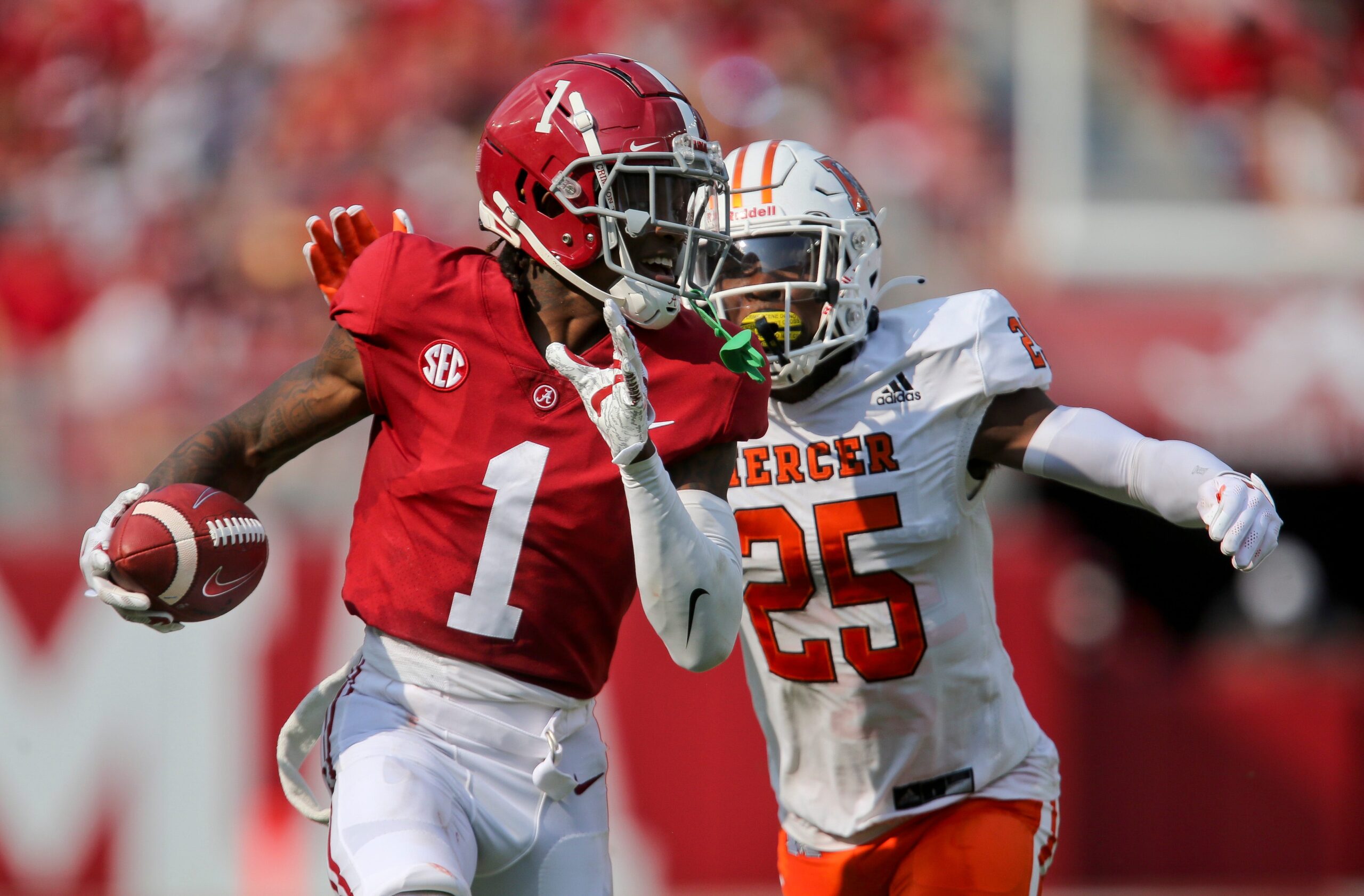 Alabama wide receiver Jameson Williams (1) runs away from Mercer cornerback TJ Moore (25) after catching a pass Saturday, Sept. 11, 2021, in Bryant-Denny Stadium. The gain was negated by a penalty. [Staff Photo/Gary Cosby Jr.] Alabama Vs Mercer