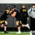 Iowa offensive lineman, left, Griffin Liddle runs a drill with Beau Stephens during a spring NCAA football practice, Thursday, March 30, 2023, at the University of Iowa Indoor Practice Facility in Iowa City, Iowa.