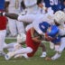 Oct 7, 2023; Lawrence, Kansas, USA; UCF Knights defensive end Malachi Lawrence (51) tackles Kansas Jayhawks quarterback Jason Bean (9) during the second half at David Booth Kansas Memorial Stadium.