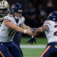 Nov 5, 2023; New Orleans, Louisiana, USA; Chicago Bears quarterback Tyson Bagent (17) hands the ball off to running back Roschon Johnson (23) against the New Orleans Saints during the first half at the Caesars Superdome.