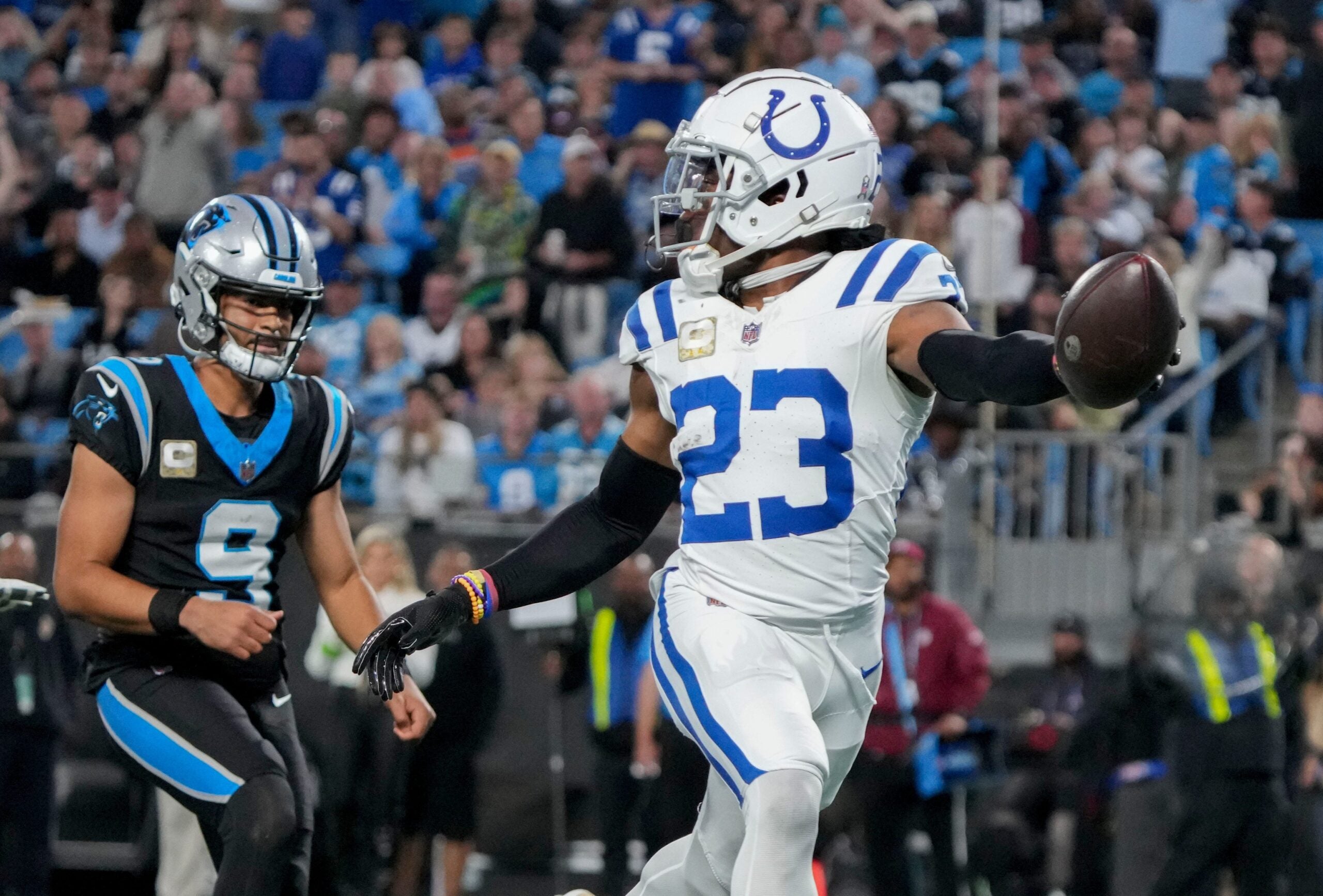 Indianapolis Colts cornerback Kenny Moore II (23) runs 49 yards for a touchdown after intercepting a pass by Carolina Panthers quarterback Bryce Young (9) on Sunday, Nov. 5, 2023, during a game against the Carolina Panthers at Bank of America Stadium in Charlotte.