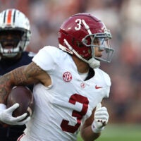 Nov 25, 2023; Auburn, Alabama, USA; Alabama Crimson Tide wide receiver Jermaine Burton (3) carries for a touchdown during the second quarter against the Auburn Tigers at Jordan-Hare Stadium.