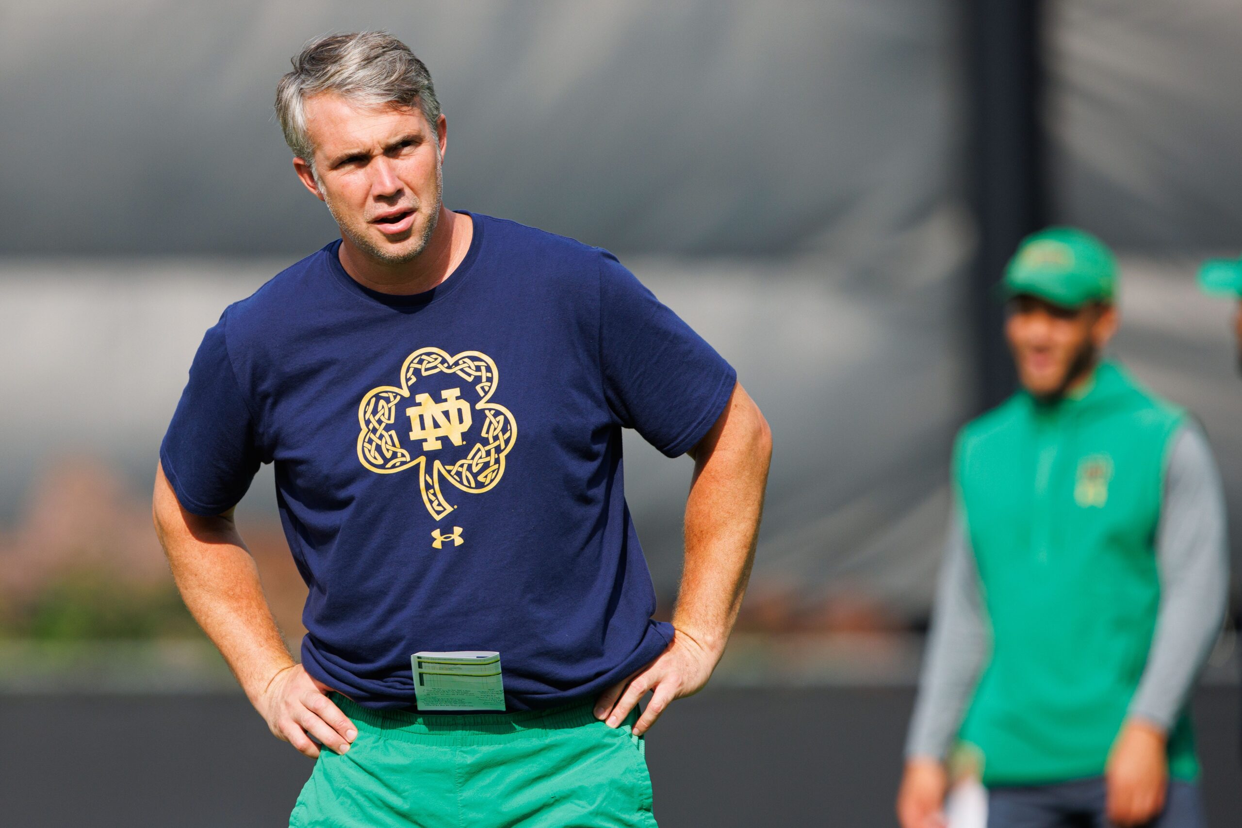 Notre Dame quarterbacks coach Gino Guidugli watches players warm up during a Notre Dame football practice at Irish Athletic Center on Tuesday, Aug. 6, 2024, in South Bend.