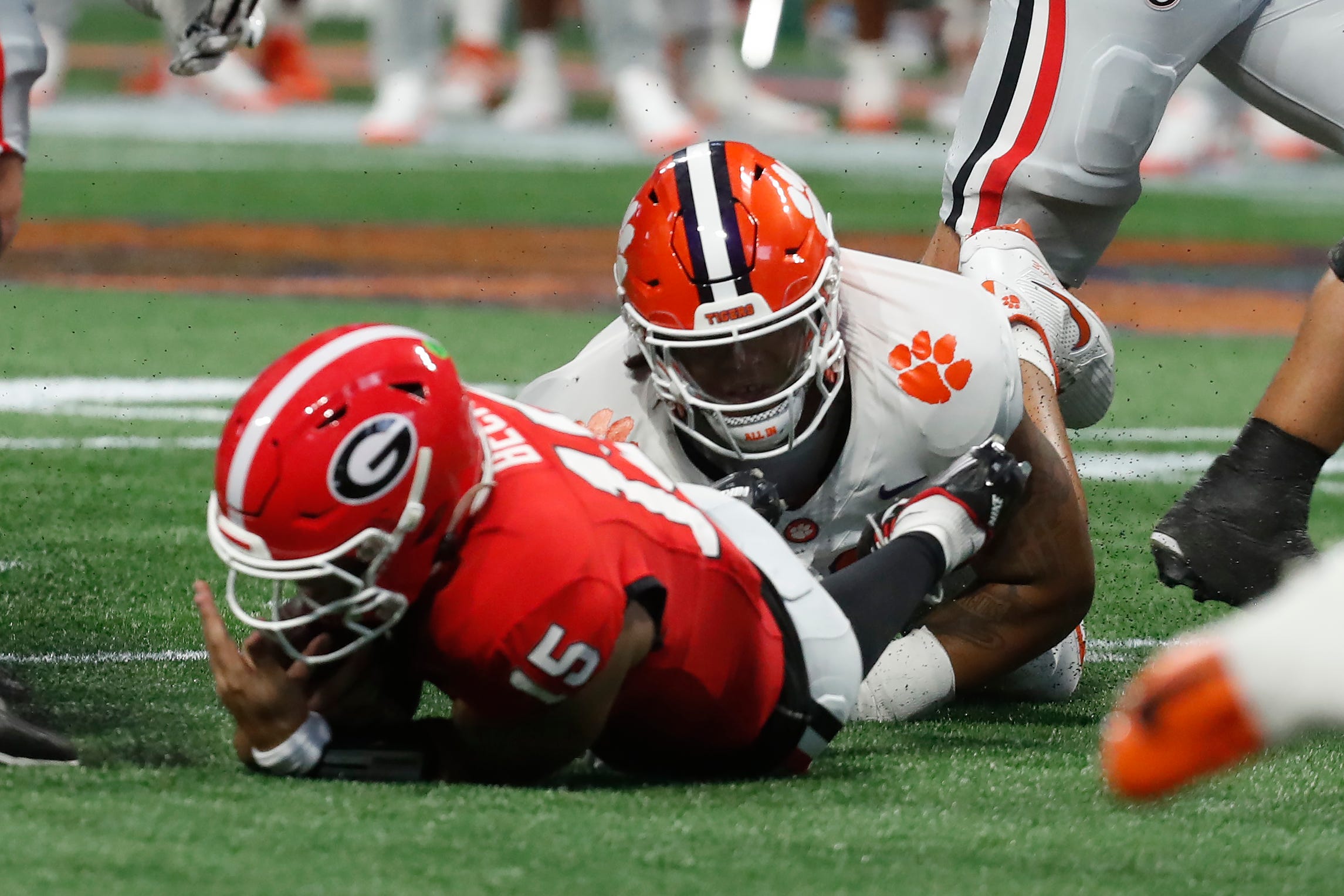 Clemson defensive lineman Peter Woods (11) sacks Georgia quarterback Carson Beck (15) during the first half of the NCAA Aflac Kickoff Game against Clemson in Atlanta, on Saturday, Aug. 31, 2024.