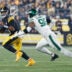 Oct 20, 2024; Pittsburgh, Pennsylvania, USA; Pittsburgh Steelers quarterback Russell Wilson (3) scrambles against pressure from New York Jets defensive end Will McDonald IV (99) during the first quarter at Acrisure Stadium.