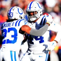 Dec 15, 2024; Denver, Colorado, USA; Indianapolis Colts linebacker Zaire Franklin (44) celebrates his interception with cornerback Kenny Moore II (23) in the first quarter against the Denver Broncos at Empower Field at Mile High.