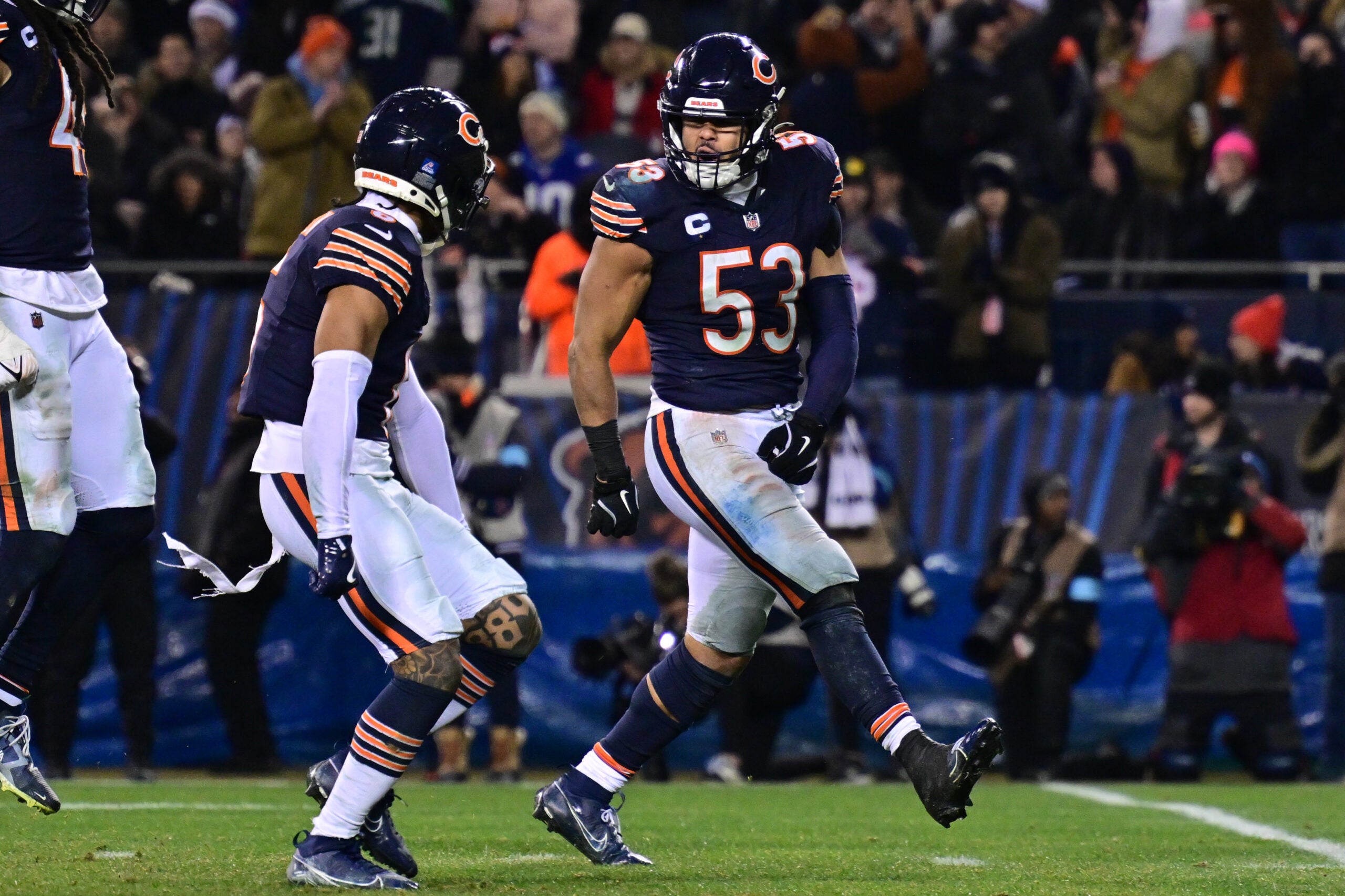 Dec 26, 2024; Chicago, Illinois, USA; Chicago Bears linebacker T.J. Edwards (53) and cornerback Kyler Gordon (6) celebrate a defensive stop against the Seattle Seahawks during the fourth quarter at Soldier Field.