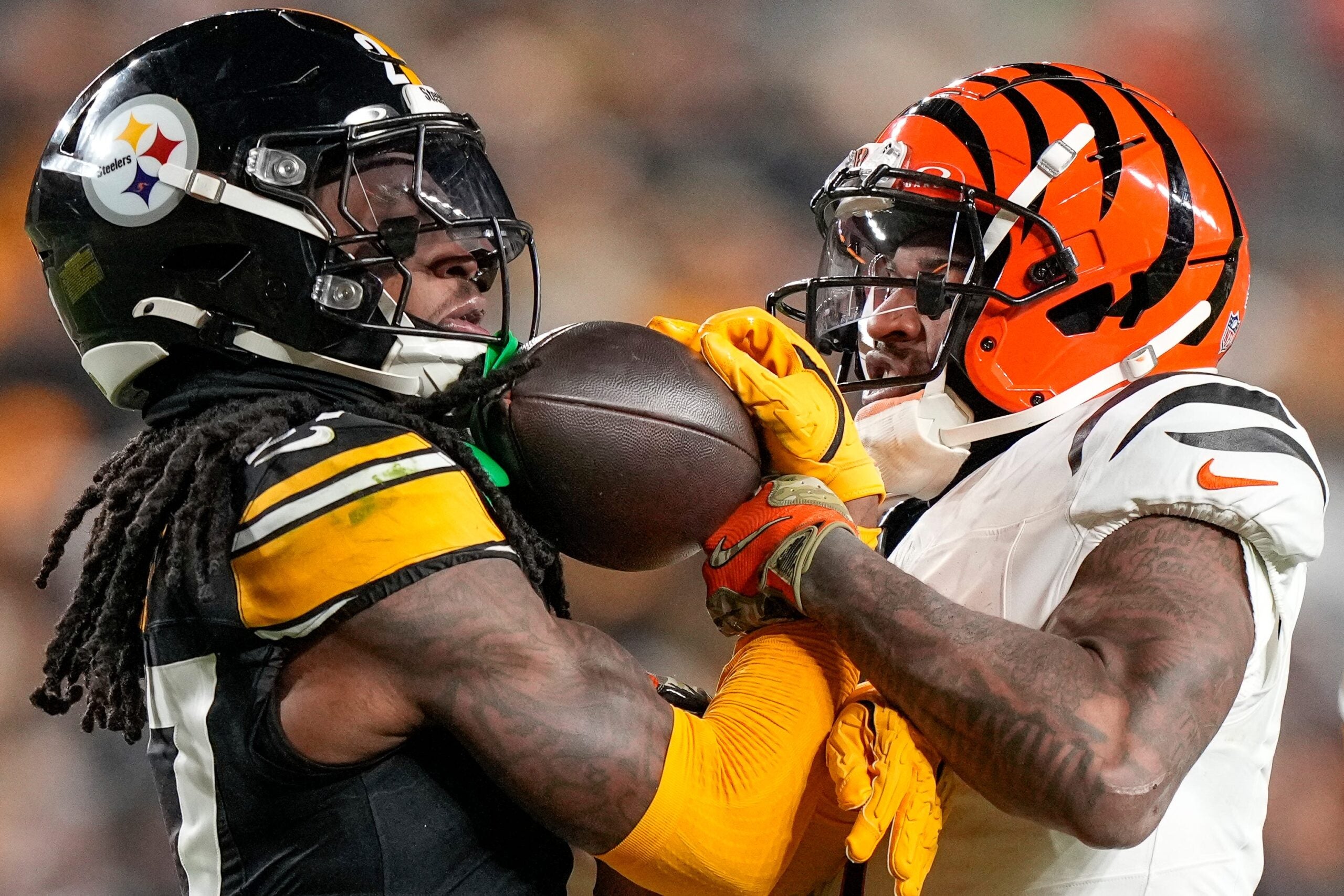 Pittsburgh Steelers cornerback Cory Trice Jr. (27) and Cincinnati Bengals wide receiver Ja'Marr Chase (1) tussle over a dead ball after a play in the second quarter of the NFL Week 18 game between the Pittsburgh Steelers and the Cincinnati Bengals at Acrisure Stadium in Pittsburgh on Saturday, Jan. 4, 2025.