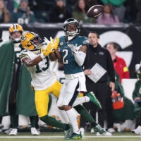 Jan 12, 2025; Philadelphia, Pennsylvania, USA; Philadelphia Eagles cornerback Darius Slay Jr. (2) makes an interception against Green Bay Packers wide receiver Dontayvion Wicks (13) during the first half in an NFC wild card game at Lincoln Financial Field.