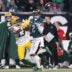 Jan 12, 2025; Philadelphia, Pennsylvania, USA; Philadelphia Eagles cornerback Darius Slay Jr. (2) makes an interception against Green Bay Packers wide receiver Dontayvion Wicks (13) during the first half in an NFC wild card game at Lincoln Financial Field.