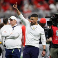 Jan 20, 2025; Atlanta, GA, USA; Notre Dame Fighting Irish head coach Marcus Freeman during warmups before the CFP National Championship college football game at Mercedes-Benz Stadium.