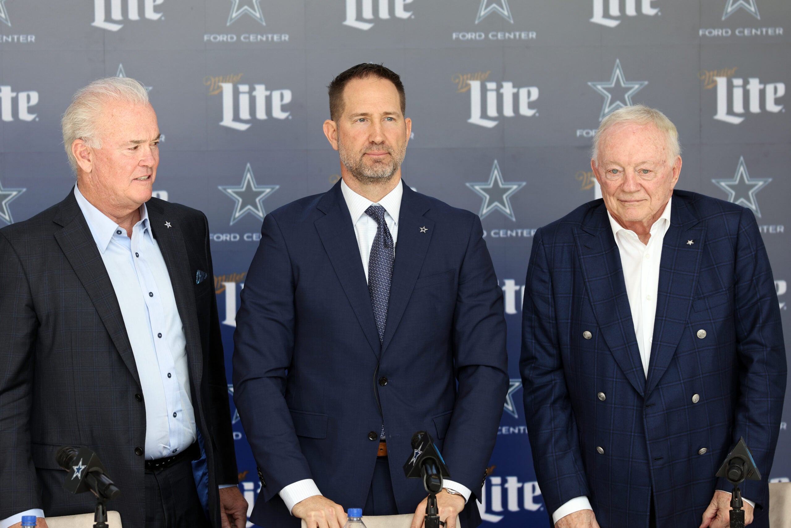 Jan 27, 2025; Frisco, TX, USA; (L to R) Dallas Cowboys CEO Stephen Jones,head coach Brian Schottenheimer and owner Jerry Jones pose for pictures after a press conference at the Star.