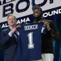 Apr 24, 2025; Green Bay, WI, USA; NFL commissioner Roger Goodell with Alabama Crimson Tide offensive lineman Tyler Booker after he is selected by the Dallas Cowboys as the number twelve pick in the first round of the 2025 NFL Draft at Lambeau Field.