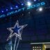 The Dallas Cowboys logo is projected on the video board during the NFL Draft at Lambeau Field.