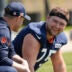 May 10, 2025; Lake Forest, IL, USA; Chicago Bears head coach Ben Johnson talks with offensive lineman (75) Ozzy Trapilo during rookie minicamp at Halas Hall.