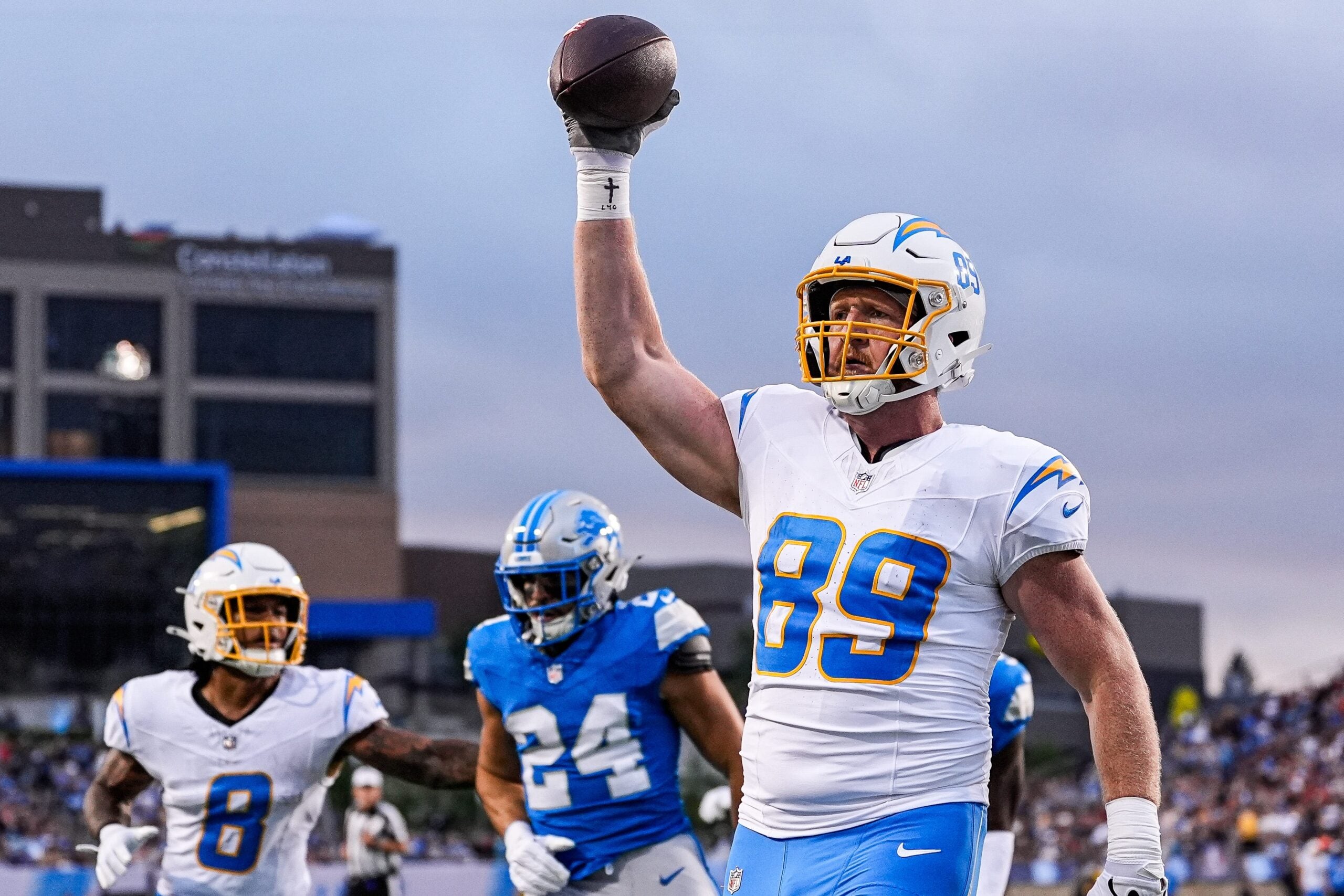 LA Chargers tight end Will Dissly (89) makes a catch for a touchdown against Detroit Lions during the first half of the Hall of Fame Game at Tom Benson Hall of Fame Stadium in Canton, Ohio on Thursday, July 31, 2025.