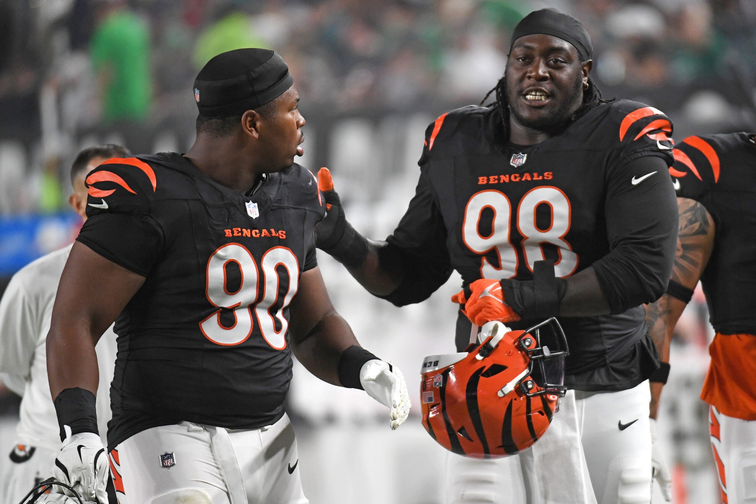 Aug 7, 2025; Philadelphia, Pennsylvania, USA; Cincinnati Bengals defensive tackle Kris Jenkins Jr. (90) and defensive tackle T.J. Slaton Jr. (98) walk off the field at halftime against the Philadelphia Eagles at Lincoln Financial Field.